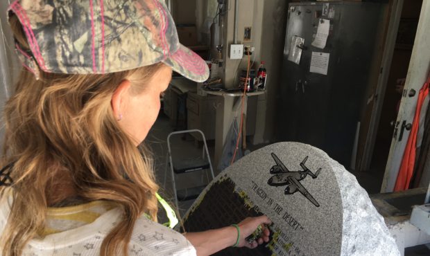A worker puts the final touches on a monument telling the story of the ill-fated flight and the rec...