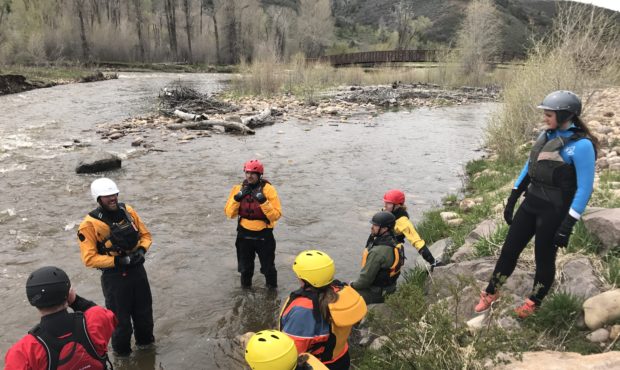 Instructor Matt Haberman speaks to Swiftwater Rescue Fundamentals students on the upper Provo River...
