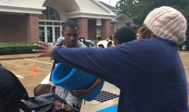 Kinnette Middleton greets her older son, days after they were separated by the storm. They were re-...