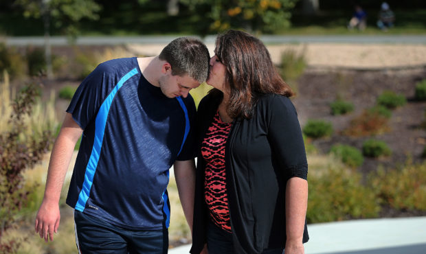 Laura Anderson kisses her son Ty at Vista Education Campus in Farmington in this Oct. 22, 2015, fil...