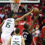 Utah Jazz forward Derrick Favors (15) blocks a shot by Houston Rockets forward Luc Mbah a Moute (12) as the Utah Jazz and the Houston Rockets play game two of the NBA playoffs at the Toyota Center in Houston on Wednesday, May 2, 2018. (Photo: Scott G. Winterton, Deseret News) 
