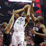 Utah Jazz guard Donovan Mitchell (45) is fouled by Houston Rockets guard Chris Paul (3) as he goes up for a shot as the Utah Jazz and the Houston Rockets play game two of the NBA playoffs at the Toyota Center in Houston on Wednesday, May 2, 2018. (Photo: Scott G. Winterton, Deseret News) 
