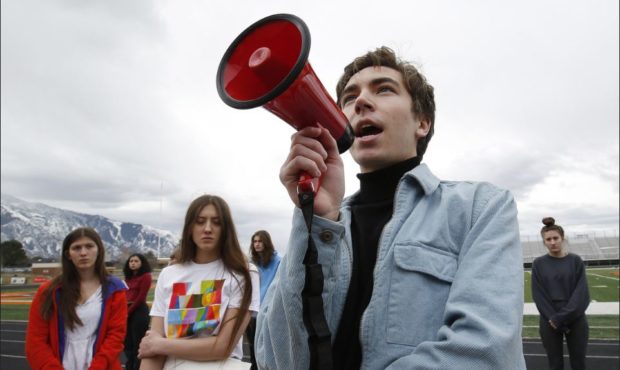 Brighton High School student Isaac Reese speaks to students during a walkout in Cottonwood Heights ...