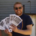 Wright's son, Ian, displays the walking tour of Eureka handouts that have been created in part because of the annual ride. 