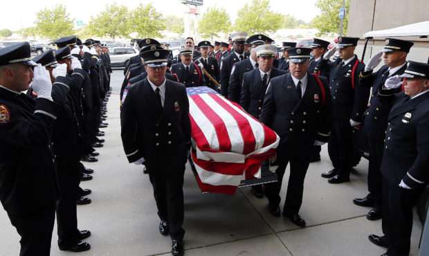 Fallen firefighter Matthew Burchett's casket arrives at the Maverik Center...