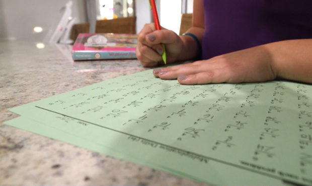 A student at Jeremy Ranch works through her math problems. (KSL TV)...