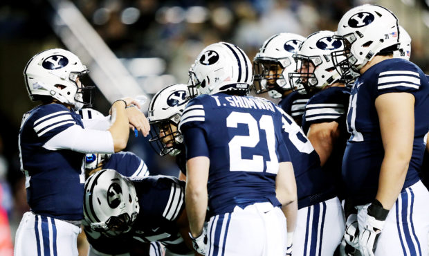 Brigham Young Cougars quarterback Zach Wilson (11) calls the play in the huddle as BYU and Hawaii p...