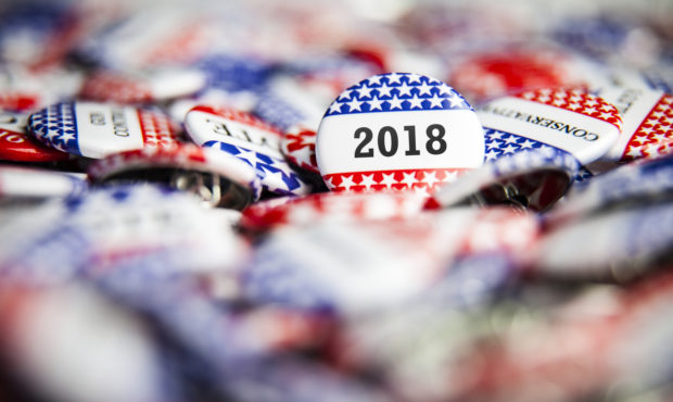 A 2018 Election Vote button on a pile of other buttons...