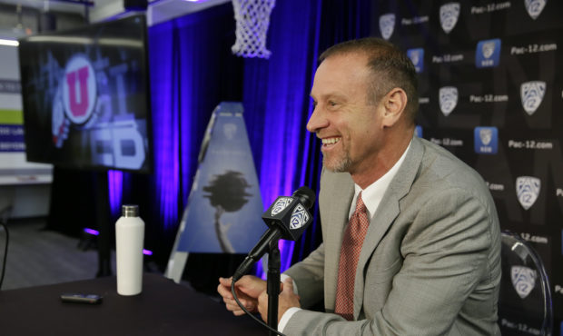 Utah head coach Larry Krystkowiak answers questions during the Pac-12 NCAA college basketball media...