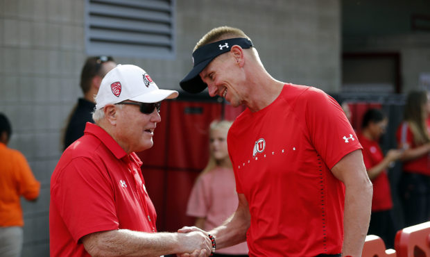 Ron McBride, left, and Gary Anderson meet before NCAA football in Salt Lake City on Thursday, Aug. ...