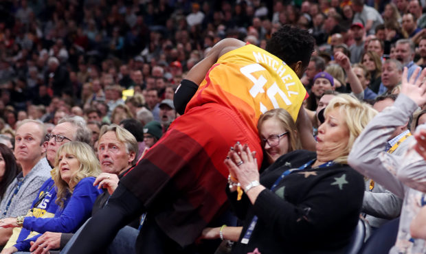 Utah Jazz guard Donovan Mitchell (45) crashes into the front two rows as the Utah Jazz and the Gold...