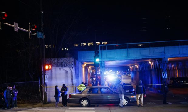 Police investigate the scene where two officers were struck by a train on Monday, Dec. 17, 2018. (A...
