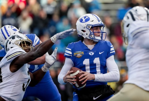 Brigham Young Cougars quarterback Zach Wilson (11) moves under pressure from Western Michigan Bronc...