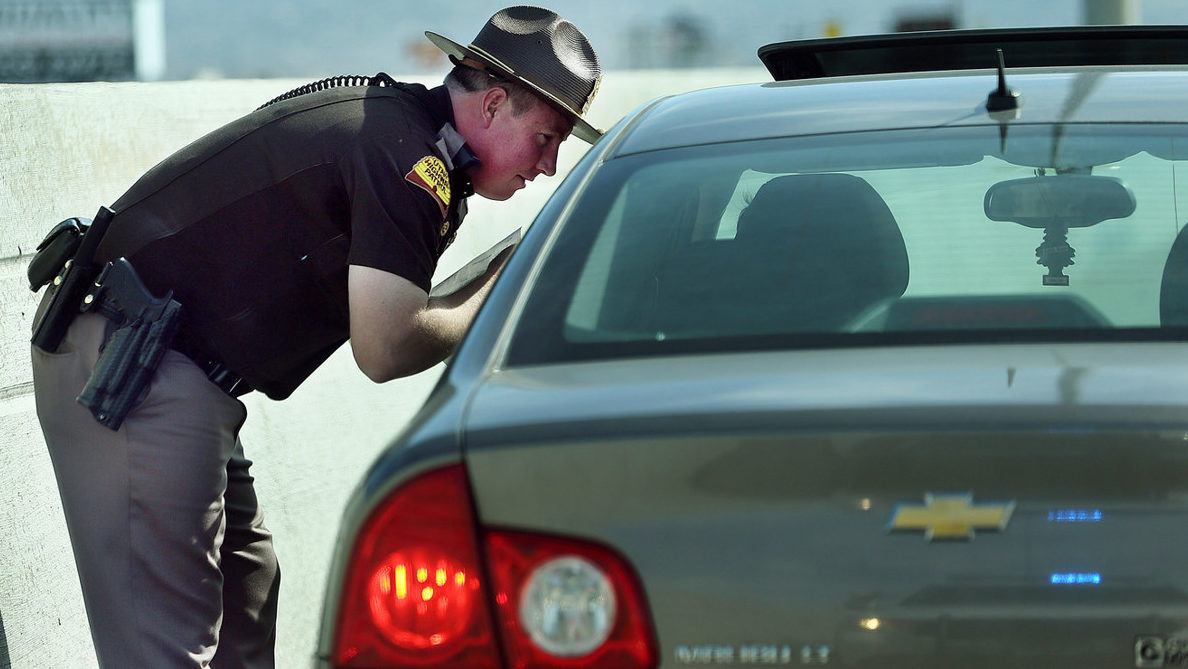 trooper speaks to pulled over car, drunk driving is likely during new year's...