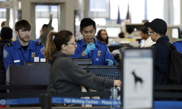 Transportation Security Administration officers work at a checkpoint at O'Hare airport in Chicago, ...