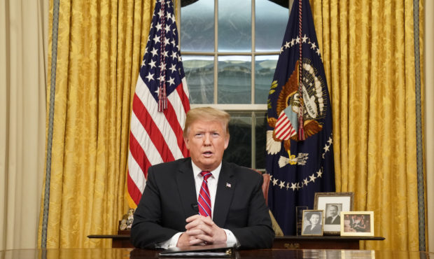 President Donald Trump speaks from the Oval Office of the White House as he gives a prime-time addr...