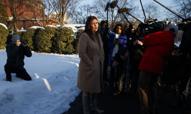 White House press secretary Sarah Huckabee Sanders talks with reporters outside the White House, We...