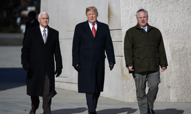 President Donald Trump, center, Vice President Mike Pence, left, escorted by Acting Interior Secret...