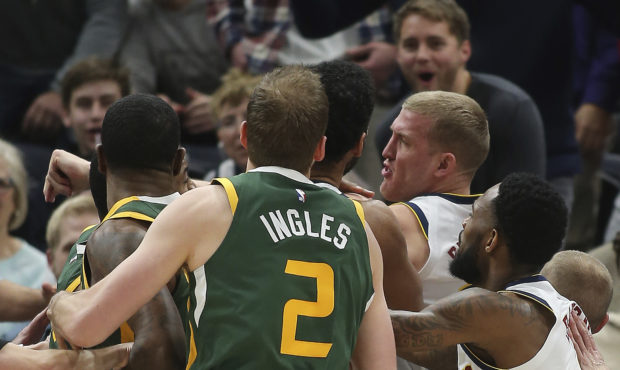 Utah Jazz and Denver Nuggets players get into a scuffle during an NBA basketball game in Salt Lake ...