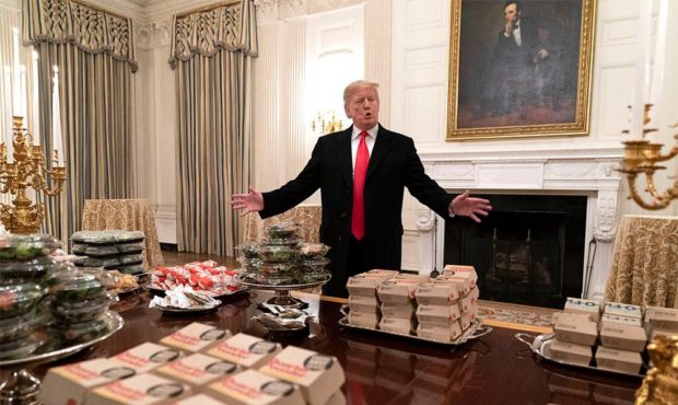U.S President Donald Trump watches as candles are lit as he presents fast food to be served to the ...