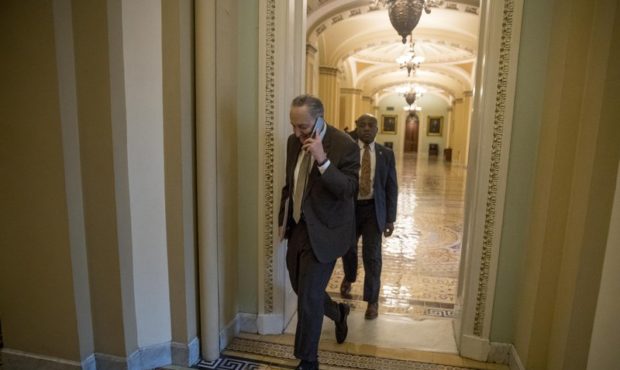 Senate Minority Leader Sen. Chuck Schumer of N.Y. arrives on Capitol Hill in Washington, Thursday, ...