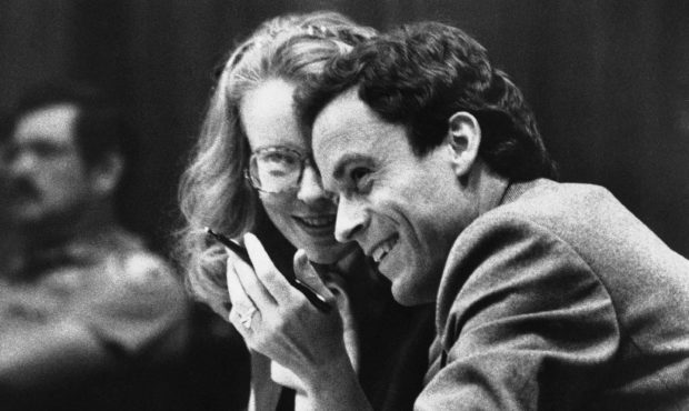 FILE - In this July 6, 1979 file photo, Ted Bundy, right, confers with Margaret Good, a member of h...