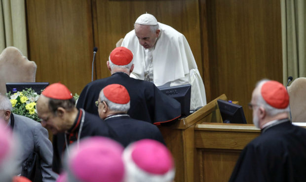 Pope Francis arrives at the opening of the second day of a Vatican's conference on dealing with sex...