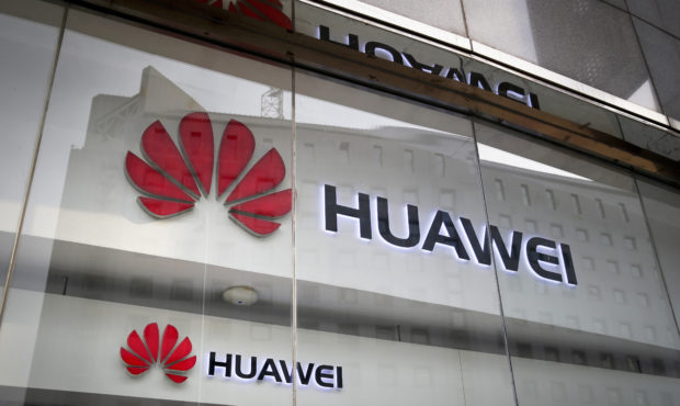 FILE - In this Jan. 29, 2019, file photo, the logos of Huawei are displayed at its retail shop wind...