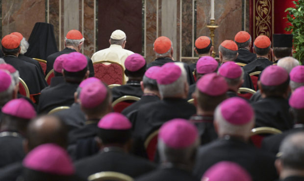 Pope Francis, background third from left, attends a penitential liturgy at the Vatican, Saturday, F...
