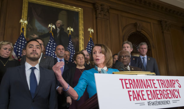 House Speaker Nancy Pelosi of Calif., accompanied by Rep. Joaquin Castro, D-Texas, left, and others...