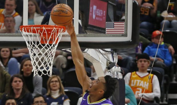 Utah Jazz guard Donovan Mitchell (45) goes to the basket as Washington Wizards forward Troy Brown J...