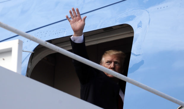 President Donald Trump boards Air Force One, Sunday, March 24, 2019, at Palm Beach International Ai...