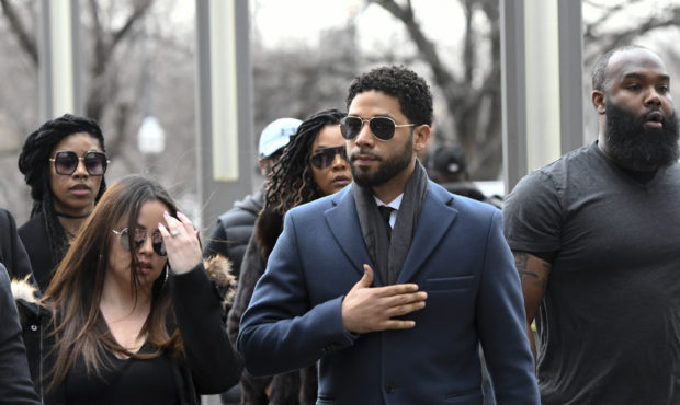Empire actor Jussie Smollett, center, arrives at the Leighton Criminal Court Building for his heari...