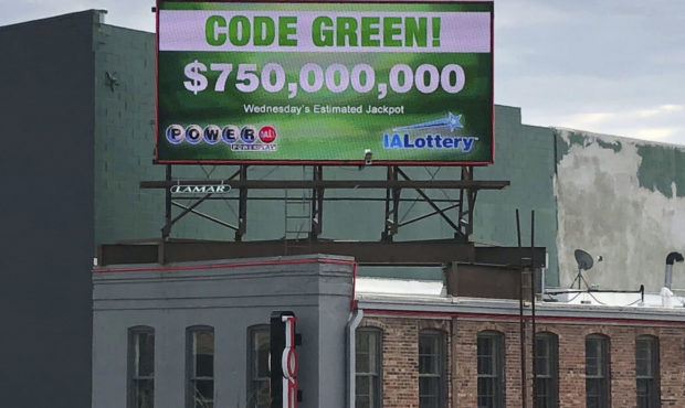A billboard promotes an estimated $750 million Powerball jackpot in downtown Des Moines, Iowa, Wedn...