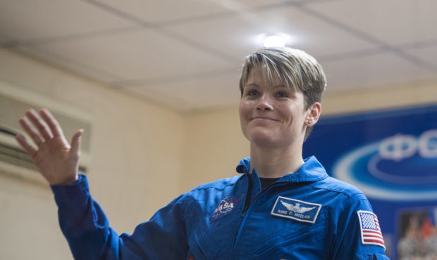 FILE - In this handout provided by NASA, Expedition 58 Flight Engineer Anne McClain of NASA waves d...