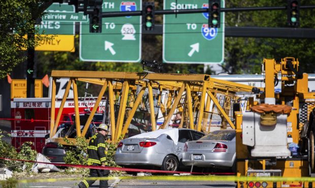 Emergency crews work the scene of a construction crane collapse near the intersection of Mercer Str...