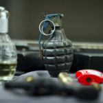 An inert hand grenade is seen along with other banned items taken from passengers at Transportation Security Administration (TSA) checkpoints at Dulles International Airport in Dulles, Va., Tuesday, March 26, 2019. TSA’s social media presence has been something of a model for other federal agencies _ striking a tone is humorous, but still gives travelers informational dos and don’ts.(AP Photo/Cliff Owen)