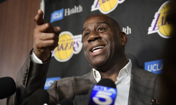 Magic Johnson speaks to reporters prior to an NBA basketball game between the Los Angeles Lakers an...