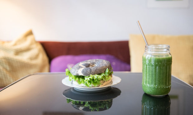 BERLIN, GERMANY - JANUARY 27: A vegan bagel and green smoothie is pictured at vegan cafe No Milk To...