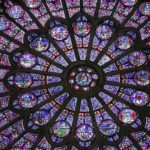 Shown is one of three famous stained glass windows from Notre Dame cathedral in Paris.