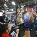 Cesar Revero, 6, looks at a display of the Infinity Gauntlet seen in the film Avengers: Infinity War during the FanX Spring Comic Convention at the Salt Palace Convention Center in Salt Lake City on Friday, April 19, 2019.