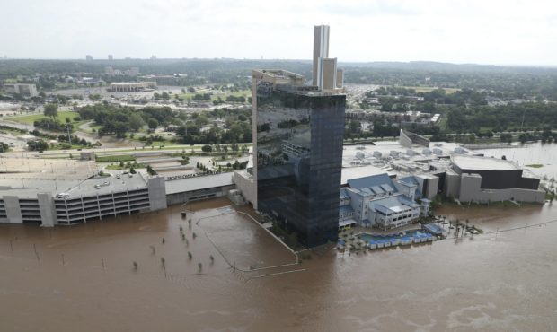The River Spirit Hotel and Casino has flood waters surrounding it on the Arkansas River on Friday, ...