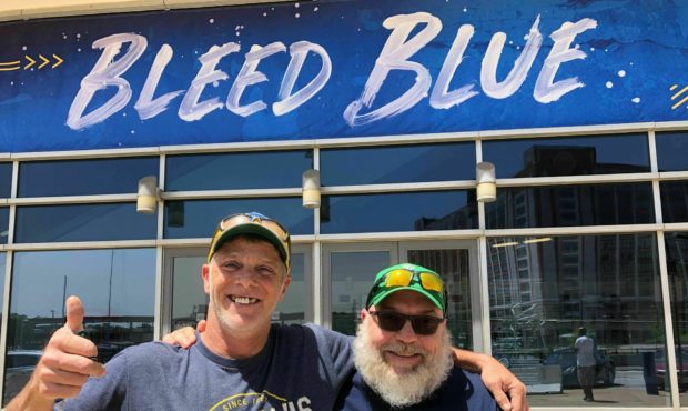 In this May 22, 2019 photo, longtime St. Louis Blues fans Stanley Jackson, left, and Steven Crow st...