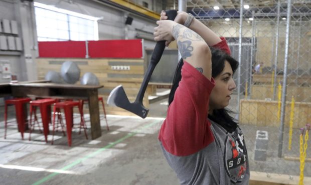 General manager Devan Watanabe throws an axe at Social Axe Throwing Wednesday, May 1, 2019, in Salt...