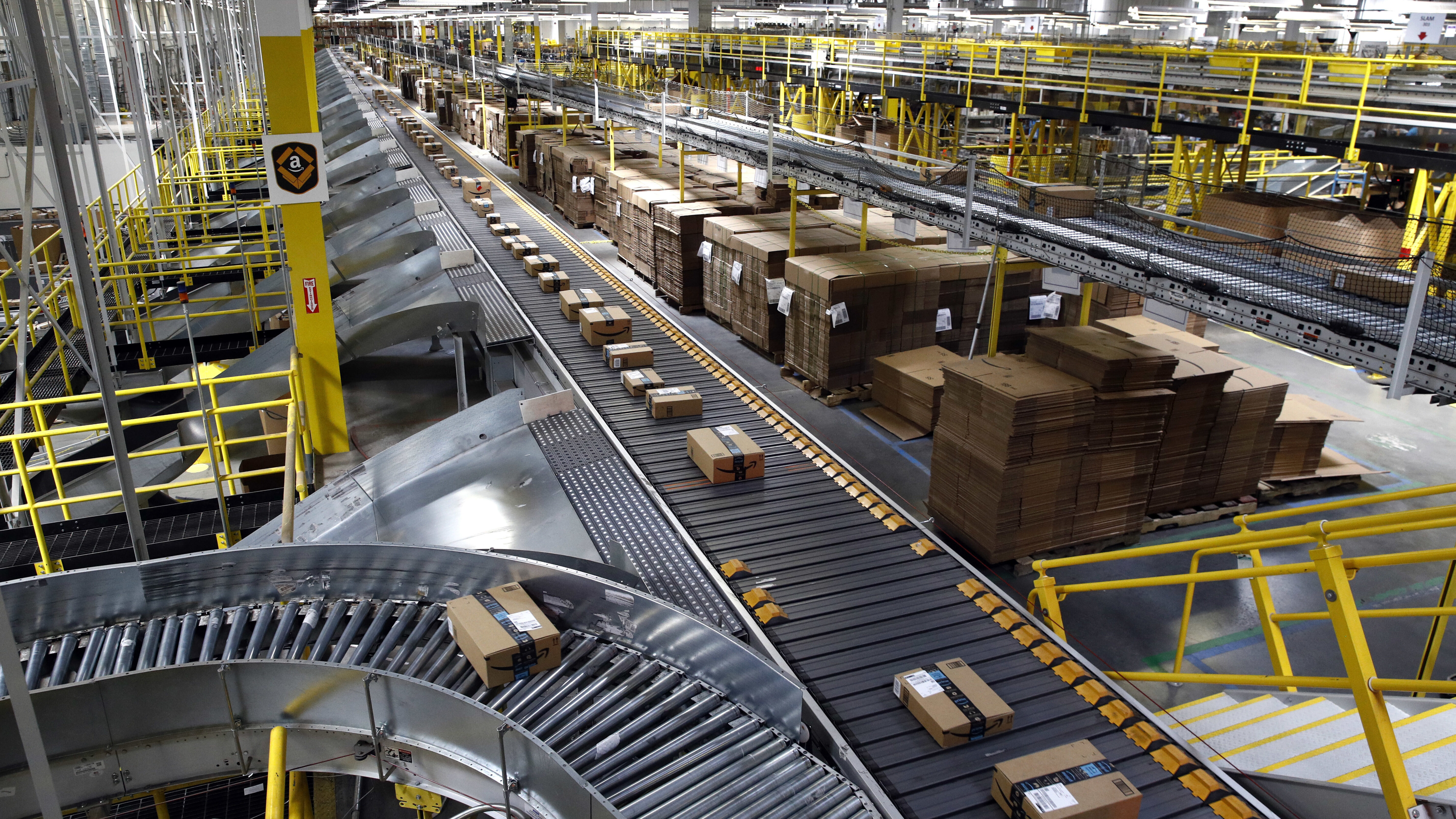 Packages are seen in an Amazon warehouse. Amazon Prime Day is here, which means a lot of deals, and...
