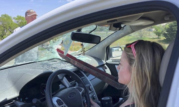 This Monday, May 13, 2019, photo provided by Jordan Snow shows Nicci Sanders in her vehicle narrowl...