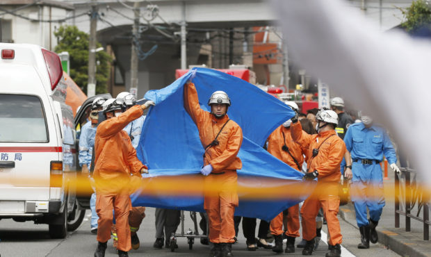 Rescuers work at the scene of an attack in Kawasaki, near Tokyo Tuesday, May 28, 2019. A man wieldi...