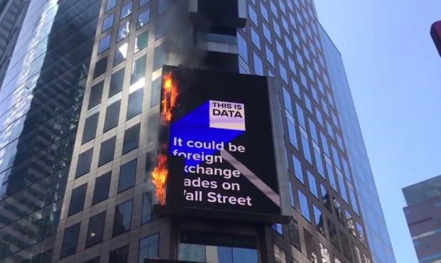 In this image from video provided by WABC TV, flames shoot from the digital billboard at 3 Times Sq...