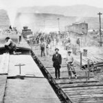 FILE - In this April 28, 1869, file photo, workers laying tracks for Central Pacific Railroad pause for a moment at camp "Victory," a few miles from Promontory, Utah. The May 10, 1869, completion of the Transcontinental Railroad was a pivotal moment in the United States, ushering in a period of progress and expansion nationwide.
(AP Photo, File)