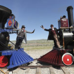 A historic photo from 1869 is recreated with Doug Foxley, left, and Spencer Stokes, co-chairs of the event, during the 150th anniversary celebration at the Golden Spike National Historical Park in Promontory, Utah, on Friday, May 10, 2019. (Jeffrey D. Allred/The Deseret News via AP)